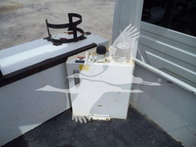 Altec L37M crane equipment on job site showing white hydraulic reservoir with cap and control area.