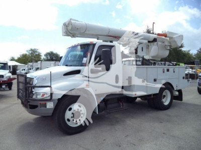Altec L37M crane truck in-service showing boom and utility body with compartments.