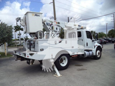 Altec L37M crane-mounted boom truck side view showing White utility vehicle with bucket and stabilizers.