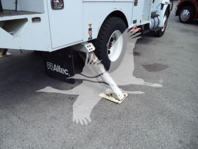 Altec L37M crane with stabilizer deployed on asphalt; visible Altec logo on mudflap and white body; rear wheel and hydraulic stabilizer leg in view.