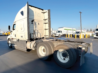 Truck tractor cab and chassis viewed from rear-left side showing sleeper cab and fifth wheel connection on a Freightliner Cascadia126.