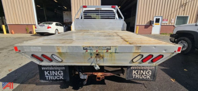 Flatbed rear view of a 2008 Ford F-350 Super Duty dual rear wheel truck showing metal deck and taillights.