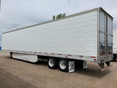 Trailer side view showing a 2017 Utility reefer trailer with a white aluminum side, dual rear axles, and a hinged rear door.