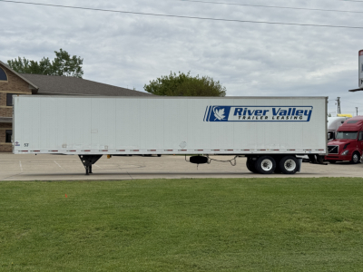 Trailer side view showing River Valley Trailer Leasing logo on a long white utility trailer.