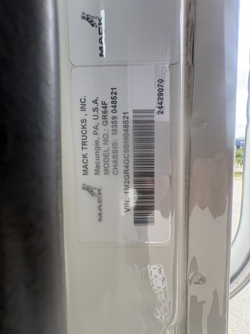 Truck door label with VIN and stock number showing Mack Trucks Inc. model GT? NO, shows VIN 1M2GR4GC9SM048521 and stock number B3419P.