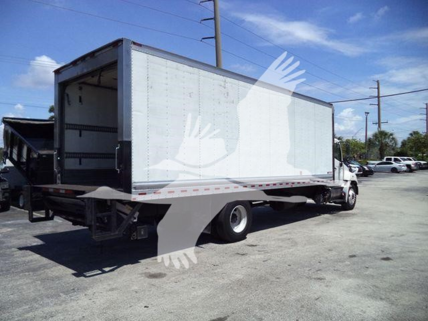2019 Hino 268A refrigerated truck showing cargo box with open rear doors and dual rear axles.
