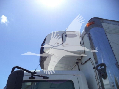 Truck cab side with refrigeration unit mounted on the front of tractor, Hino 268A, ladder and door visible, blue exterior.