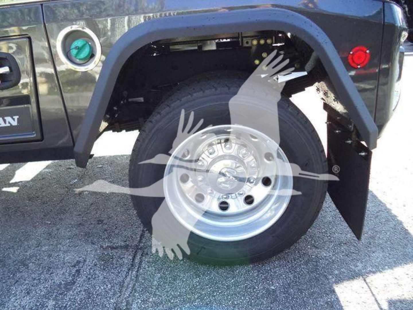 Ram 5500 wheel and fender area with spare wheel, winch category vehicle showing front wheel and fender flares.