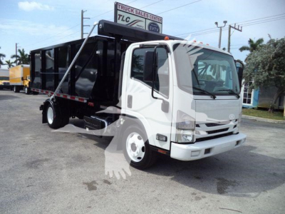 Isuzu NPR/NRR truck with dump bed in service showing cab and cargo area.
