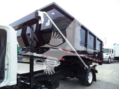 Isuzu NPR/Nrr dump bed truck in-service showing roll-off dump body and hydraulic hoist, side view with mounting legs and rear wheel, VIN/stock notations not visible on image text