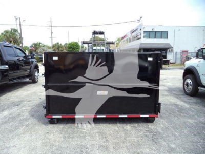 Isuzu NPR/NRR rolloff body back view showing black dump trailer with white graphics and reflective tape at lower edge.