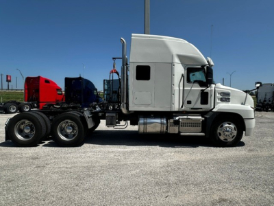 2020 Mack ANTHEM truck side view showing sleeper cab, fuel tanks, exhaust, and wheels.
