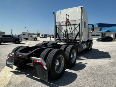 Truck tractor rear and cab view of a 2020 Mack Anthem sleeper with dual rear axles and fifth wheel; visible rear fenders, mud flaps, and connectors.