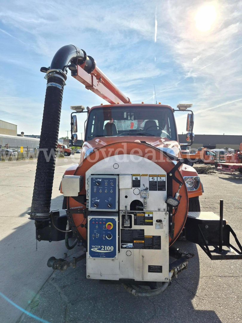 Front view of a 2017 Freightliner 114SD vacuum truck with rear-mounted pump and hoses, VIN 1FVHG3CY1HHHZ7753.