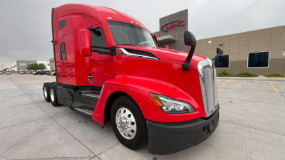 Kenworth T680 semi-truck in red with sleeper cab, front grille, and side mirrors. text visible includes Kenworth branding and truck features.
