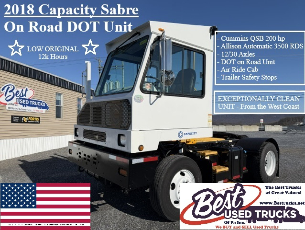 Truck in yard showing 2018 Capacity Sabre On Road DOT unit listing features such as Cummins QSB 200 hp, Allison Automatic 3500 RDS, 12/30 axles, DOT on road unit, air ride cab, trailer safety stops.