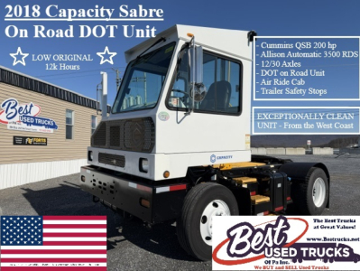 Truck in yard showing 2018 Capacity Sabre On Road DOT unit listing features such as Cummins QSB 200 hp, Allison Automatic 3500 RDS, 12/30 axles, DOT on road unit, air ride cab, trailer safety stops.
