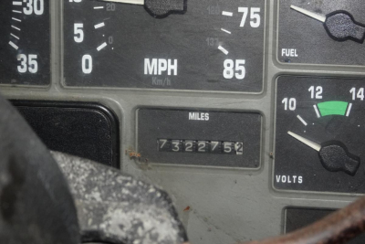 Dashboard showing speedometer with mph scale and an odometer reading 732,275 miles, plus fuel and volt gauges visible.
