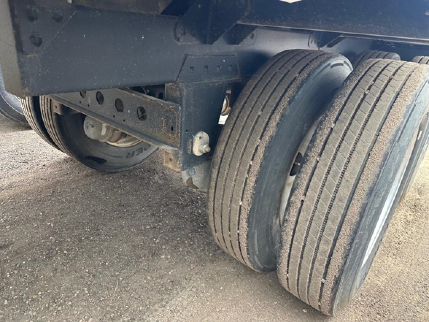 Timpte Super Hopper trailer axle area showing dual wheels and undercarriage components.