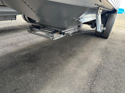 Trailer undercarriage showing lower rear hopper hitch and frame hardware on a Timpte Super Hopper.
