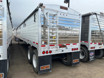 Timpte Super Hopper trailer rear view showing Tandem axle with mud flaps and Timpte branding on trailer and license plate area.