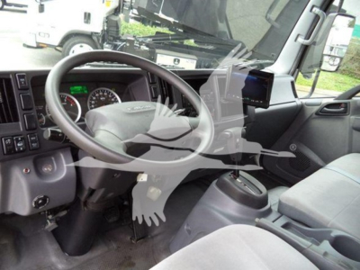 Isuzu NQR truck interior showing steering wheel and dashboard with digital gauge cluster and center console