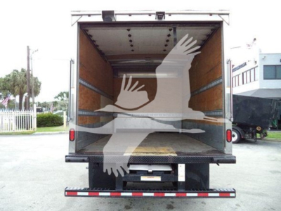 Isuzu NQR box truck cargo area with open rear doors showing wooden interior and loading ramp.