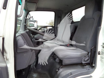 Isuzu NQR cab interior showing front seats and dashboard in-view.