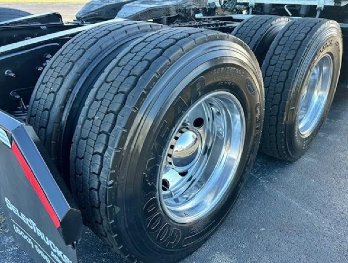 Freightliner Cascadia 116 rear dual tires and chrome wheel rims showing heavy-duty truck configuration.