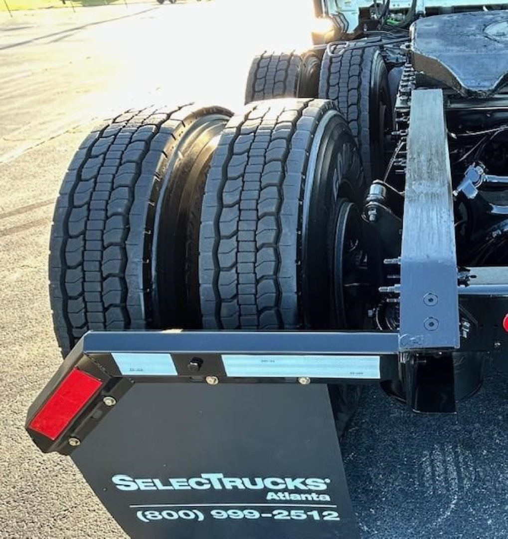 Freightliner Cascadia 116 rear dual drive tires and chassis with SelectTrucks Atlanta plate area visible.