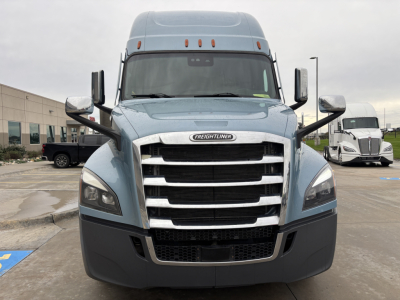 Freightliner PT126064ST front view showing grille and headlights with large chrome bumper and side mirrors.