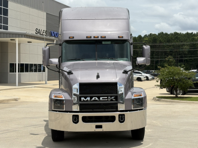 Front view of a silver Mack AN64T70 sleeper truck showing Mack grille and bumper with headlights.