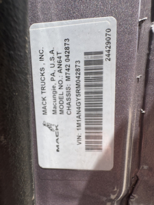 Mack Trucks label on a 2024 AN64T70 showing VIN M1TA... actually reads: MACK TRUCKS INC., MACUNG, PA, USA MODEN,  ... VIN: 1M1AN4GY5RM042873 barcode 24429070 stock number not fully legible. Text: MACK TRUCKS INC., MACUNG, PA U.S.A. CHASSIS: