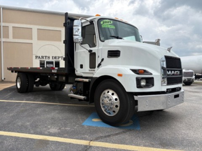 Mack MD6 flatbed truck in white with 2025 model year sticker on windshield.