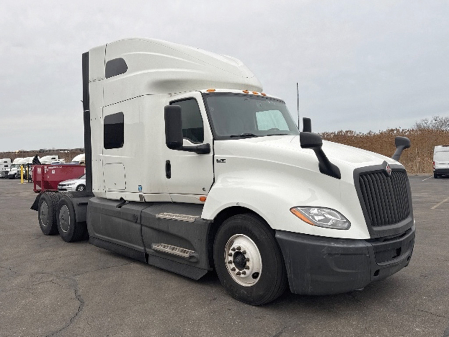 International LT625 truck in view showing front and side profile with sleeper cab and 6x4 tractor configuration.