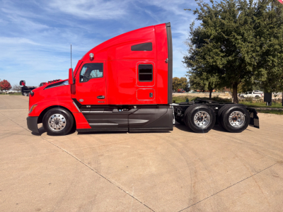 Kenworth T680 tractor-trailer in red profile view showing sleeper cab and tandem rear axles.
