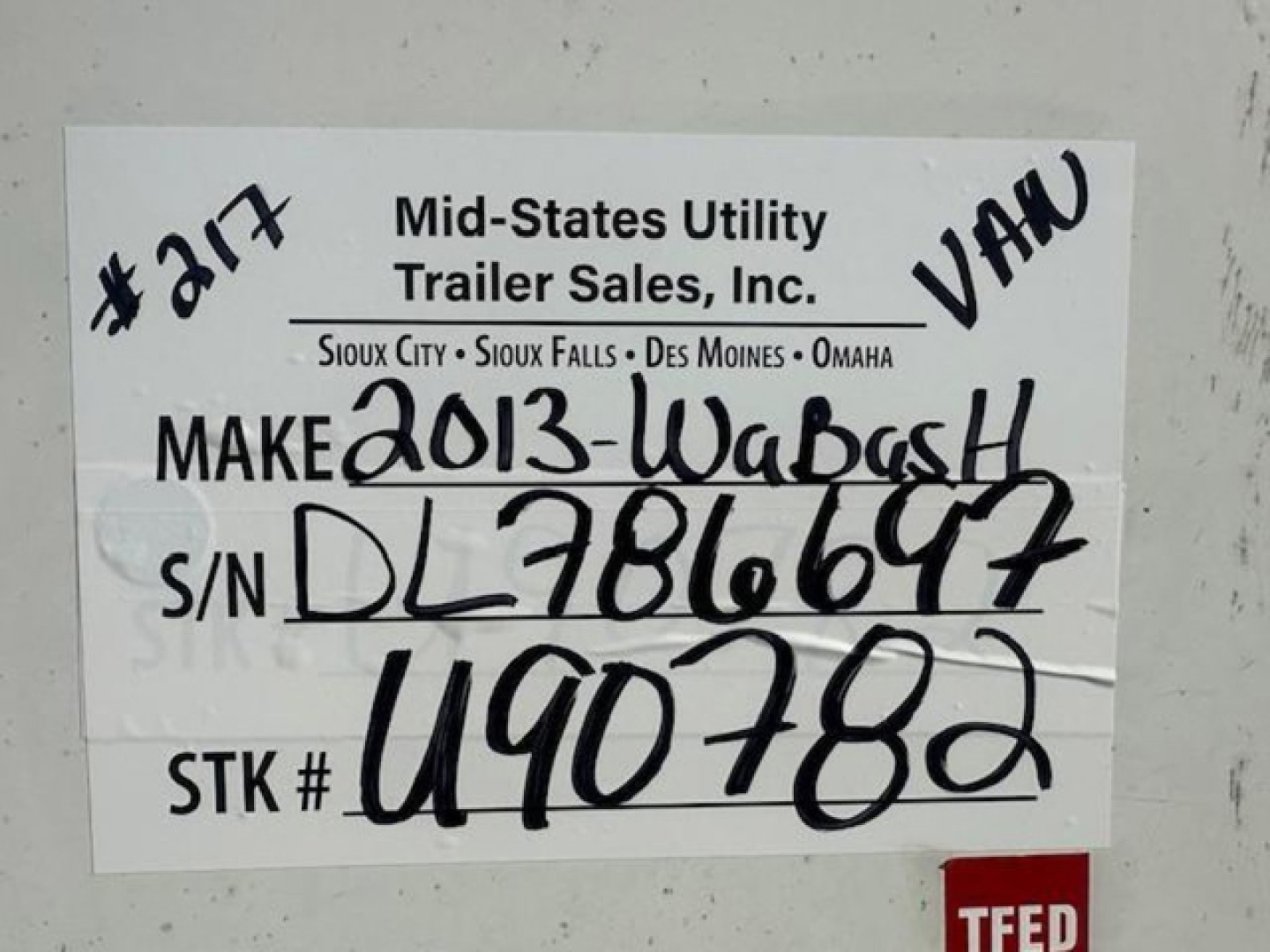 Trailer label showing Mid-States Utility Trailer Sales, Inc. with handwritten VIN/serial numbers, stock number, and make info: ‘2013-Wabash’ on the white label.