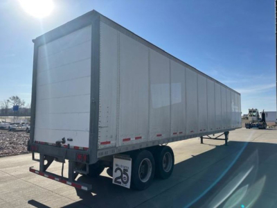 Wabash 53 ft dry van trailer with tandem axle on a sunny day. Visible text includes reflections and a low rear bumper, mud flaps, and a small dealer plate tag.