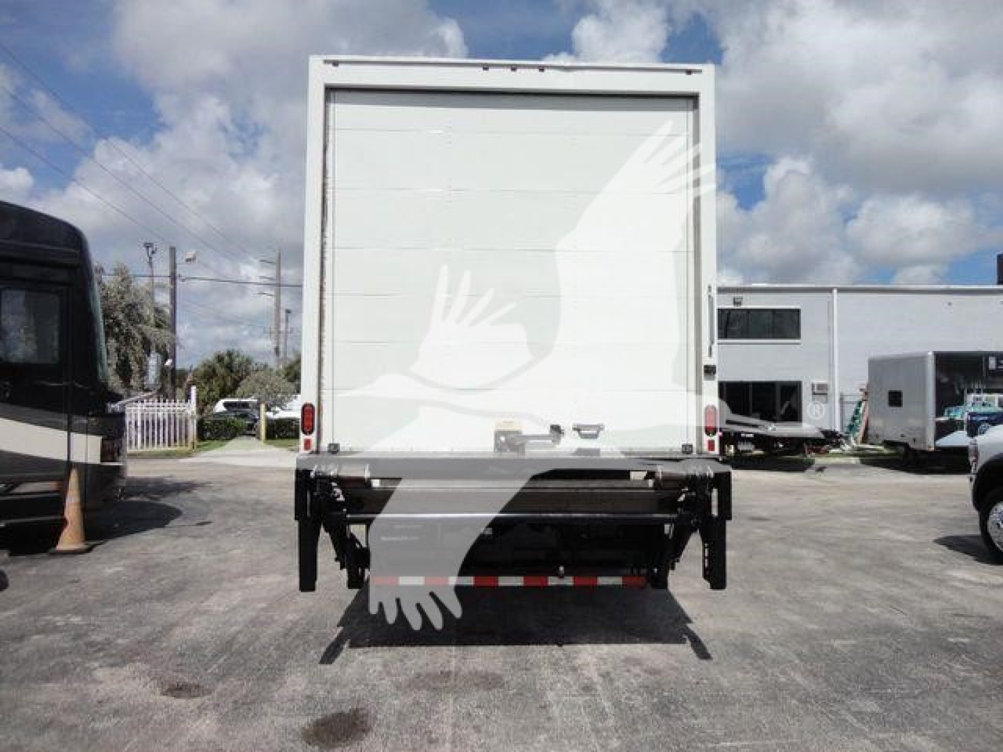 Box truck rear view showing cargo area and undercarriage for 2026 Mack MD6 with back doors closed.