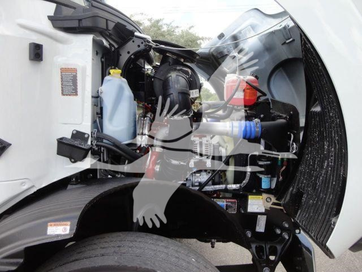 Engine bay of a 2026 Mack MD6 showing components and fluid reservoirs visible in the front-left side.