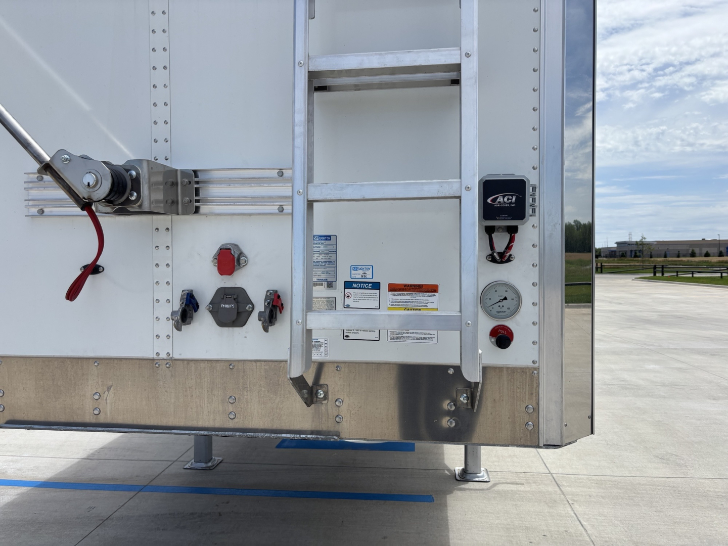 Trailer rear showing control panel and ladder on Stoughton 42' aluminum grain hopper.