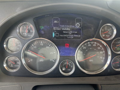 Kenworth T880 instrument cluster and center display showing gauges for RPM, speed, fuel, and warning icons in dashboard; VIN and truck info not visible.