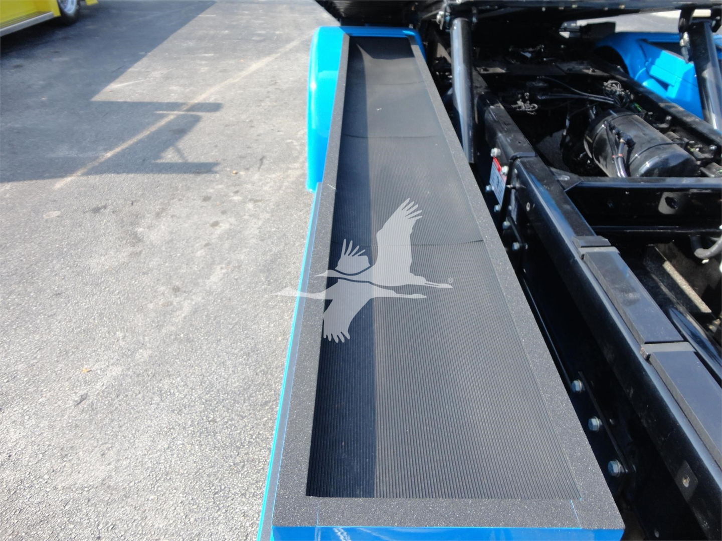 Peterbilt 337 rollback truck side panel and engine bay area with blue accents.