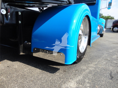 Blue Peterbilt 337 truck fender and wheel with graphic logo and chrome wheel well.