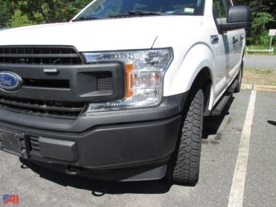 2020 Ford F-150 Crew Cab pickup front-left view showing grille, headlight, bumper, and front tire in a parking lot.