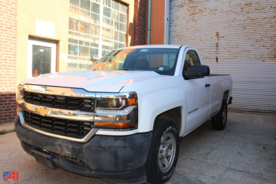 Chevrolet Silverado 1500 pickup truck in white, front three-quarter view, 2016 model year, with black front bumper and chrome grille