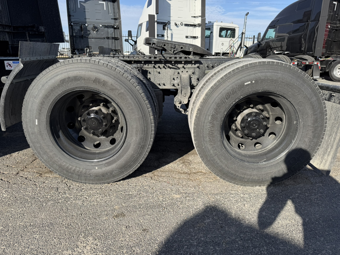 Mack PR64T76H truck dual rear wheels (axles) showing wheel rims and drivetrain area.