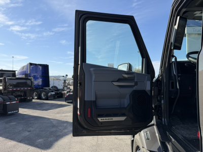 Mack PR64T76H truck cab door open showing interior door panel and 'MAK' badge