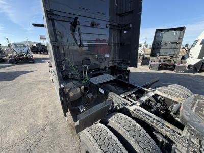 Mack PR64T76H truck cab interior rear view showing fifth wheel area and drivetrain suspension in-service components.