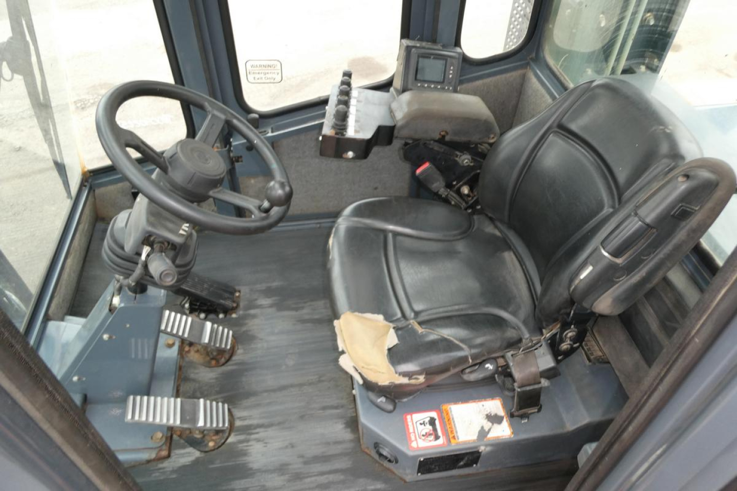Cab interior of a 2018 Toyota THD3000-24 forklift showing steering wheel, driver's seat, and control console.